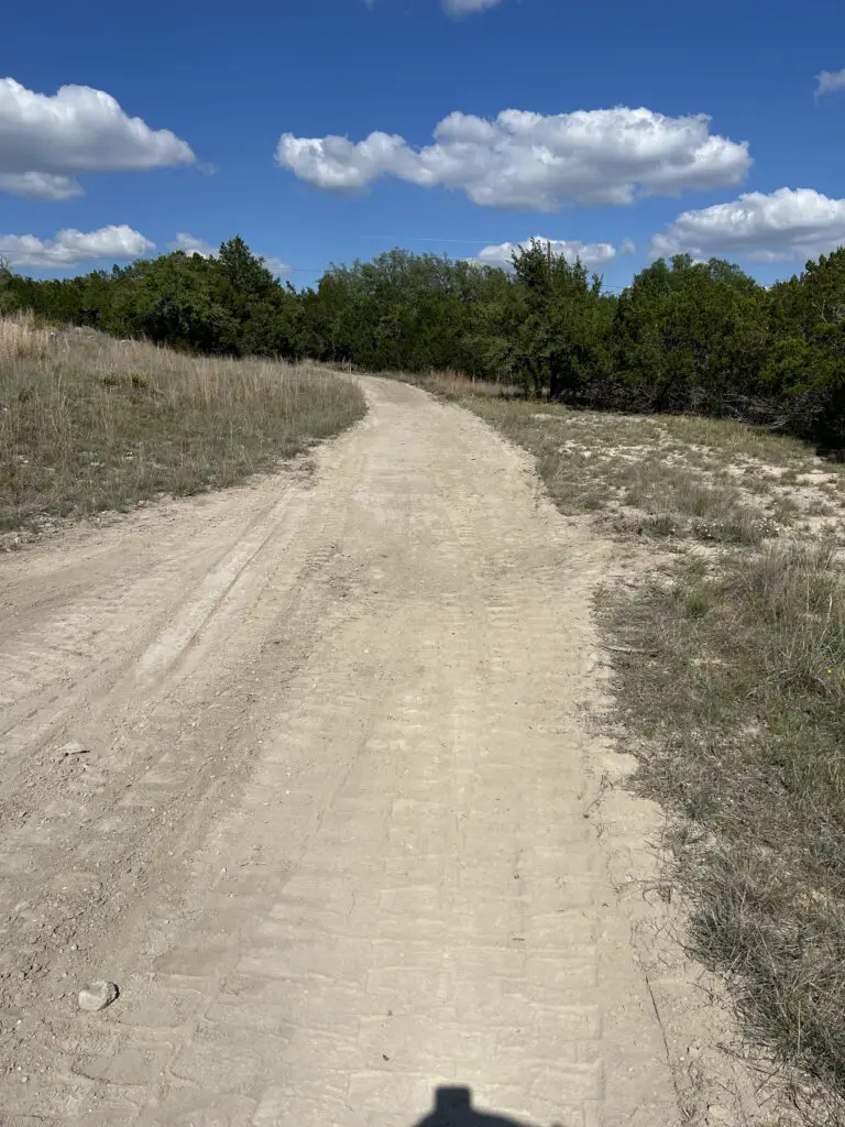 Hilliland Contracting completed rural driveway graded through Texas Hill Country brush and cedar trees near Seguin, TX